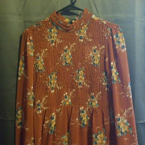 New dress. Rust in color with floral print - Picture 1 of 4
